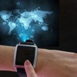 smartwatch-with-message-icons-world-map